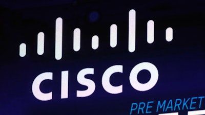 In this Oct. 3, 2018, file photo, the Cisco logo appears on a screen at the Nasdaq MarketSite in New York's Times Square.