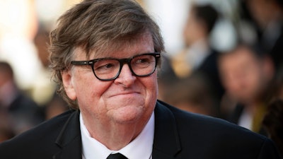 This May 25, 2019, file photo shows Michael Moore at the awards ceremony of the 72nd international film festival, Cannes, France.