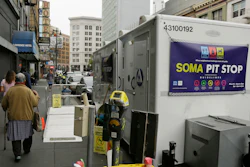 A woman walks past a 'Pit Stop' public toilet on Sixth Street, Thursday, Aug. 1, 2019, in San Francisco.