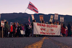 In this July 15, 2019, file photo, demonstrators block a road in Mauna Kea, Hawaii, to protest the construction of a giant telescope.