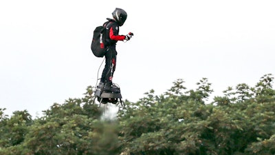 French inventor Franky Zapata flies near St. Margaret's beach, Dover after crossing the Channel on a flying board Sunday, Aug. 4, 2019.