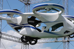 NEC Corp.'s machine with propellers hovers at the company's facility in Abiko near Tokyo, Monday, Aug. 5, 2019. The Japanese electronics maker showed a 'flying car,' a large drone-like machine with four propellers that hovered steadily for about a minute.