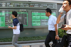 Electronic stock board of a securities firm in Tokyo, Wednesday, Aug. 7, 2019.