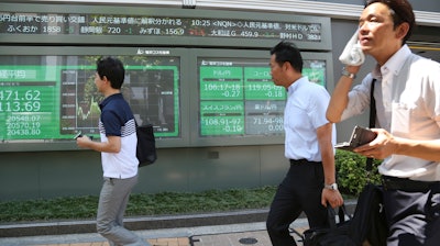 Electronic stock board of a securities firm in Tokyo, Wednesday, Aug. 7, 2019.