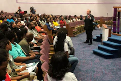 In this Aug. 6, 2019, photo, Mayor Mike Duggan speaks with Detroit residents during a job readiness event where they pre-registered to apply for jobs at a coming Fiat Chrysler assembly plant.