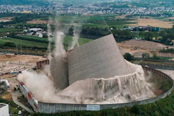 The Muelheim-Kaerlich plant collapses after remote-controlled excavators removed pillars that supported the tower, near Koblenz, Germany, Friday, Aug. 9, 2019.