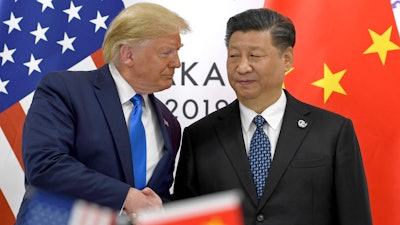 In this June 29, 2019, file photo, U.S. President Donald Trump shakes hands with Chinese President Xi Jinping at the G-20 summit in Osaka, Japan.