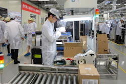 In this March 6, 2019, file photo, a staff member works on a mobile phone production line during a media tour in a Huawei factory in Dongguan, China.