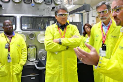 In this May 10, 2017, file photo, U.S. Secretary of Energy Rick Perry, second from left, at the Los Alamos Laboratory Plutonium Facility in Los Alamos, N.M.