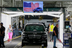 In this June 24, 2019, file photo, Ford employees work on a Lincoln Aviator line at Ford's Chicago Assembly Plant.