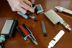 In this April 10, 2018, photo, Marshfield High School Principal Robert Keuther displays vaping devices confiscated from students in Marshfield, Mass.