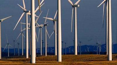 This May 6, 2013, file photo shows a wind turbine farm owned by PacifiCorp near Glenrock, Wyo.