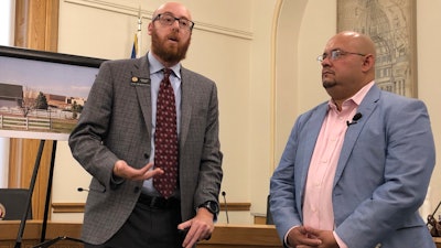 Colorado Democratic state Rep. Jonathan Singer of Longmont, left, and Joe Salazar, director of Colorado Rising, speak at a news conference in Denver on Wednesday, Aug. 14, 2019.