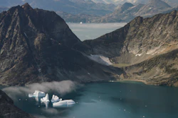 In this photo taken on Wednesday, Aug. 14, 2019, icebergs are photographed from the window of an airplane carrying NASA Scientists as they fly on a mission to track melting ice in eastern Greenland. Greenland has been melting faster in the last decade and this summer, it has seen two of the biggest melts on record since 2012.