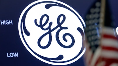 In this June 26, 2018, file photo, the General Electric logo appears above a trading post on the floor of the New York Stock Exchange.