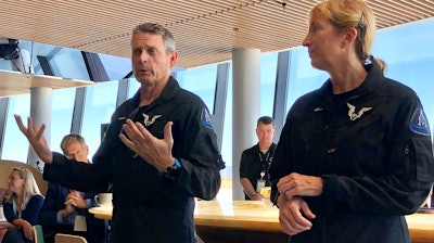 Virgin Galactic pilots Mark 'Forger' Stucky and Kelly Latimer discuss their morning test flight at Spaceport America near Upham, N.M., Thursday, Aug. 15, 2019.