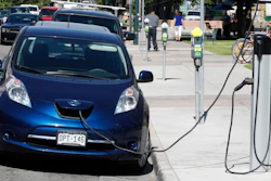 In this June 26, 2018, file photo, a Nissan Leaf at a recharge station in downtown Denver.