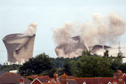 The cooling towers at the disused coal-fired Didcot power station in Oxfordshire, England, are demolished Sunday Aug. 18, 2019.