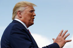 President Donald Trump speaks with reporters before boarding Air Force One at Morristown Municipal Airport in Morristown, N.J., Sunday, Aug. 18, 2019.