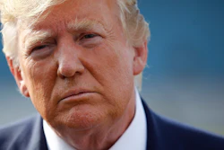 In this Aug. 18, 2019, photo, President Donald Trump speaks with reporters before boarding Air Force One at Morristown Municipal Airport in Morristown, N.J.