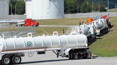 This Sept. 16, 2016, file photo shows tanker trucks lined up at a Colonial Pipeline Co. facility in Pelham, Ala.