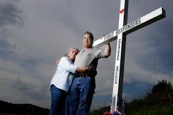 Ansol and Janie Clark pose near the Kingston Fossil Plant in Kingston, Tenn., Aug. 6, 2019.