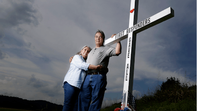 Ansol and Janie Clark pose near the Kingston Fossil Plant in Kingston, Tenn., Aug. 6, 2019.