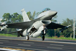 In this Sept. 16, 2014, photo, a Taiwan Air Force F-16 fighter jet lands on a closed section of highway during the annual Han Kuang military exercises in Chiayi, Taiwan.