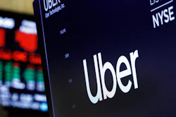 In this Aug. 9, 2019, file photo, the logo for Uber appears above a trading post on the floor of the New York Stock Exchange.