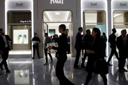 In this March 14, 2019, file photo, people attend the opening of a Piaget store during the opening night of The Shops & Restaurants at Hudson Yards in New York.