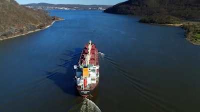 In this April 26, 2018, file photo, the Orient Dispatch, a bulk carrier ship, makes its way south on the Hudson River near Peekskill, N.Y.