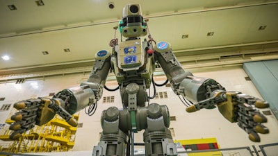 In this photo taken on Friday, July 26, 2019, and distributed by Roscosmos Space Agency Press Service, the Fedor robot is seen before being loaded into a Soyuz capsule to be launched by a new Soyuz 2.1a rocket from the launch pad at Russia’s space facility in Baikonur, Kazakhstan. The new Russian rocket, that is expected to replace the current model sending manned missions into space, blasted off Thursday, carrying a Soyuz capsule with a humanoid robot that will be tested in spaceflight conditions aboard the International Space Station (ISS).