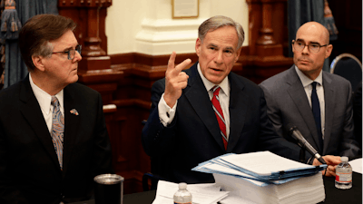 Texas Gov. Greg Abbott, center, with Speaker of the House Dennis Bonnen, right, and Lt. Governor Dan Patrick, left, makes opening statements during a round table discussion, Thursday, Aug. 22, 2019, in Austin.
