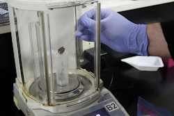 In this Friday, Aug. 16, 2019, photo, chemist David Dawson pours pieces of a cannabis-infused chocolate bar into a vial as he demonstrates testing for THC and other chemicals at CW Analytical Laboratories in Oakland, Calif. Chemists are trying to solve a scientific mystery involving marijuana brownies. Chocolate seems to throw off test results for potency. That could be dangerous for consumers looking to relax, not hallucinate.