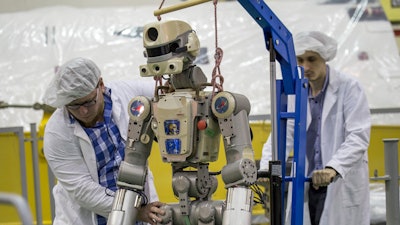 In this photo taken on Friday, July 26, 2019, and distributed by Roscosmos Space Agency Press Service, the Fedor robot is displayed before being loaded into a Soyuz capsule that was launched Thursday Aug. 22, 2019, from the launch pad at Russia's space facility in Baikonur, Kazakhstan. A Russian space capsule carrying a humanoid robot has failed to dock as planned with the International Space Station. A statement from the Russian space agency Roscosmos said the failure to dock on Saturday Aug. 24, 2019, was because of problems in the docking system, but didn't give details.