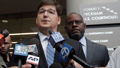 Attorneys Miles Ehrlich, left, and Ismail Ramsey, representing Anthony Levandowski, speak to reporters at a federal courthouse in San Jose, Calif., Tuesday, Aug. 27, 2019.