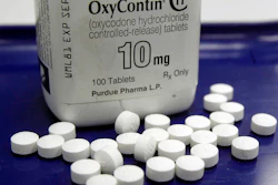 This Feb. 19, 2013, file photo shows OxyContin pills arranged for a photo at a pharmacy in Montpelier, Vt.
