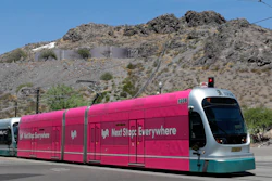 In this Monday, Aug. 26, 2019, file photo, a light rail train runs through downtown Tempe, Ariz.