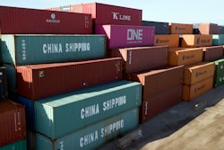 In this May 10, 2019, file photo, China Shipping Company and other containers are stacked at the Virginia International's terminal in Portsmouth, Va.