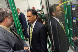 University of Vermont President Suresh Garimella speaks with Mike Austin, director of systems architecture, inside the Vermont Advanced Computing Core, UVM’s supercomputer.