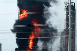 Flames and smoke rise after a fire started at an Exxon Mobil facility, Wednesday, July 31, 2019, in Baytown, Texas.