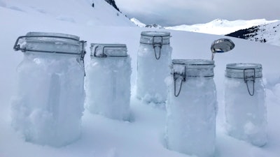 This undated photo provided by the 'Helmholtz centre for polar and marine research the Alfred Wegener institute' shows snow samples from Tschuggen, Switzerland, locked and ready for transport to Davos. Scientists of the institute say they proved plastic in the snow of the Alps and the Arctic.