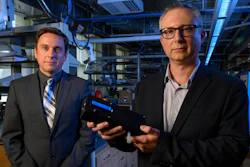 Ervin Sejdic, PhD (left) and Alexander Star, PhD, hold up the prototype of their THC-detecting device.