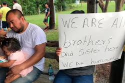 Workers from PH Foods and their supporters gather at a protest on Tuesday, Aug. 13, 2019 in Morton, Miss., after workers from the chicken processing plant said they were fired. Workers say the plant fired the majority of remaining workers days after federal agents arrested 99 people there for immigration violations.
