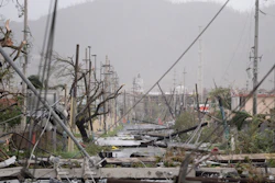 In this Sept. 20, 2017, file photo electricity poles and lines lay toppled on the road after Hurricane Maria hit the eastern region of the island, in Humacao, Puerto Rico. Despite the potential for hurricanes and other natural disasters, many small business owners don’t prepare for the worst, leaving them to learn during a crisis what they should have done differently.