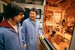 Dartmouth Assistant Professor of Chemistry Chenfeng Ke, right, talks with chemistry graduate student Miao Tang about a 3D printing project Tang designed.