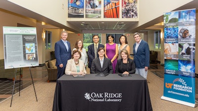 Seated are Michelle Buchanan, ORNL deputy for science and technology; Alex Lewis, CEO of Electro-Active Technologies; and Stacey Patterson, University of Tennessee Research Foundation president, who signed the licensing agreement for two ORNL microbial electrolysis technologies. Standing, from left, are Mike Paulus and Jennifer Caldwell of ORNL; Abhijeet Borole of Electro-Active Technologies; Maha Krishnamurthy of UTRF; and Edna Gergel and Brian Davison of ORNL.