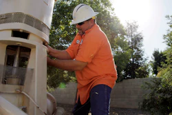 Micha Berry of the city of Fresno, Calif., which relies heavily on groundwater for its drinking water supply, repairs a groundwater well pump in 2013.