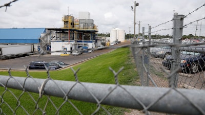 Business continues at this Koch Foods Inc., plant in Morton, Miss., Thursday, Aug. 8, 2019, following Wednesday's raid by U.S. immigration officials. In an email Thursday, U.S. Immigration and Customs Enforcement spokesman Bryan Cox said more than 300 of the 680 people arrested Wednesday have been released from custody.