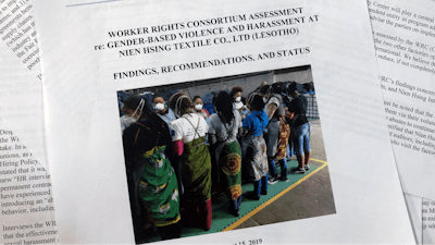 Pages from a report released from the Washington-based Worker Rights Consortium, photographed in Washington, Thursday, August 15, 2019. The report from labor rights groups says women sewing blue jeans for Levi’s, Wrangler, Lee and The Children’s Place in several African factories faced sexual harassment and gender-based violence and some were coerced into having sex with supervisors.